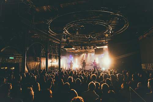 concorde 2 people attending concert inside dark room brighton